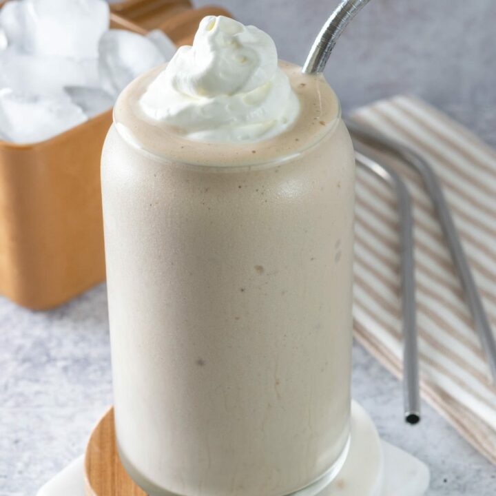 Homemade frozen coffee drink topped with whipped cream.