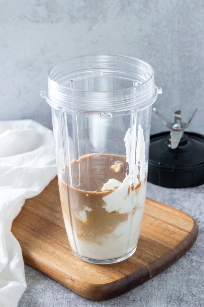 Coffee, milk and yogurt in a single-serve blender cup.