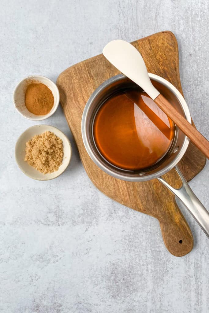 Water added to saucepan with brown sugar to make a quick simple syrup.